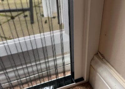 Best Fly Screens - Fly Screen fitted reveal on French double doors. The screen is fully closed.
